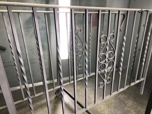 Wrought iron railings in a garage.