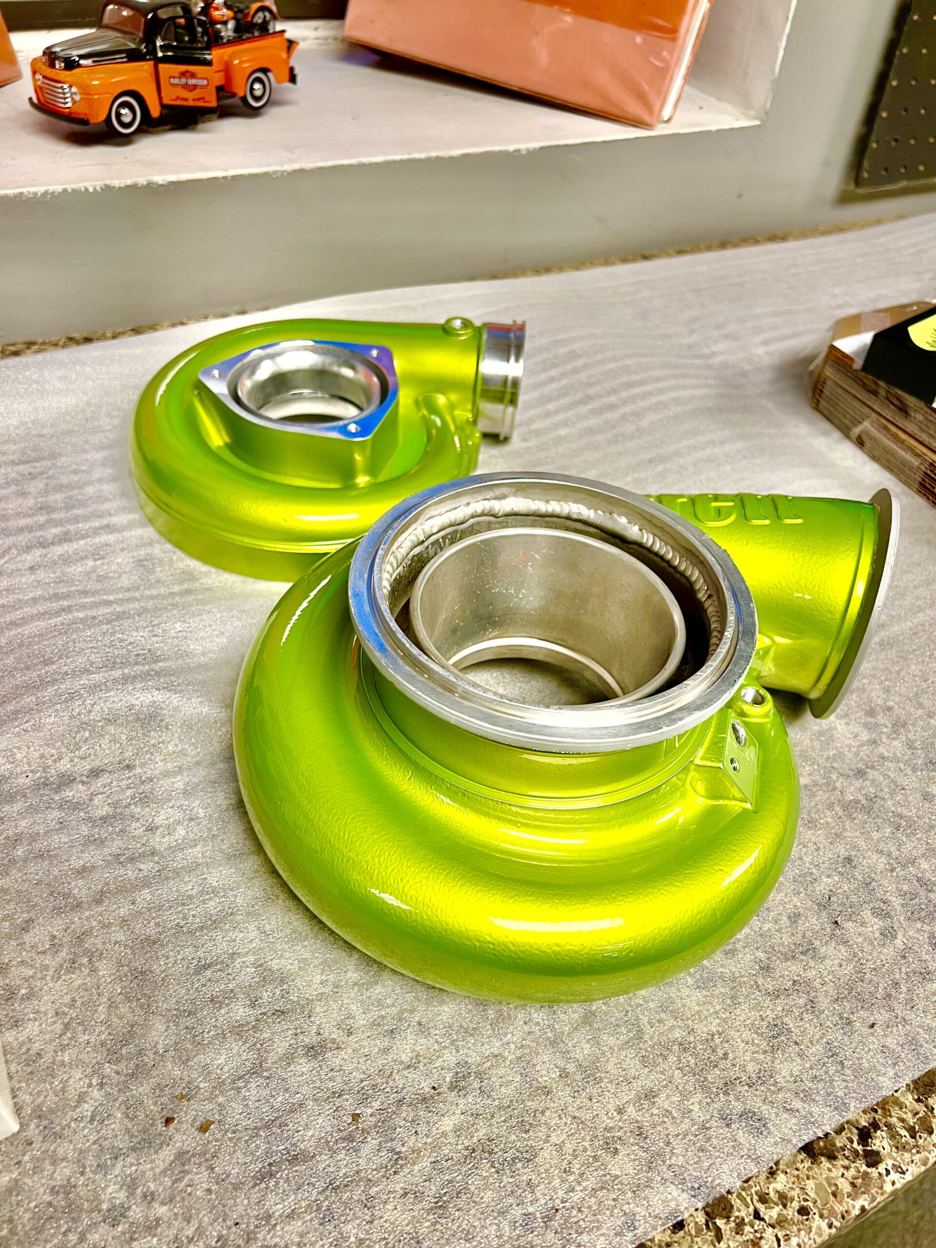 Turbos powder coated with polished aluminum base coat and prismatic shower yellow candy top coat